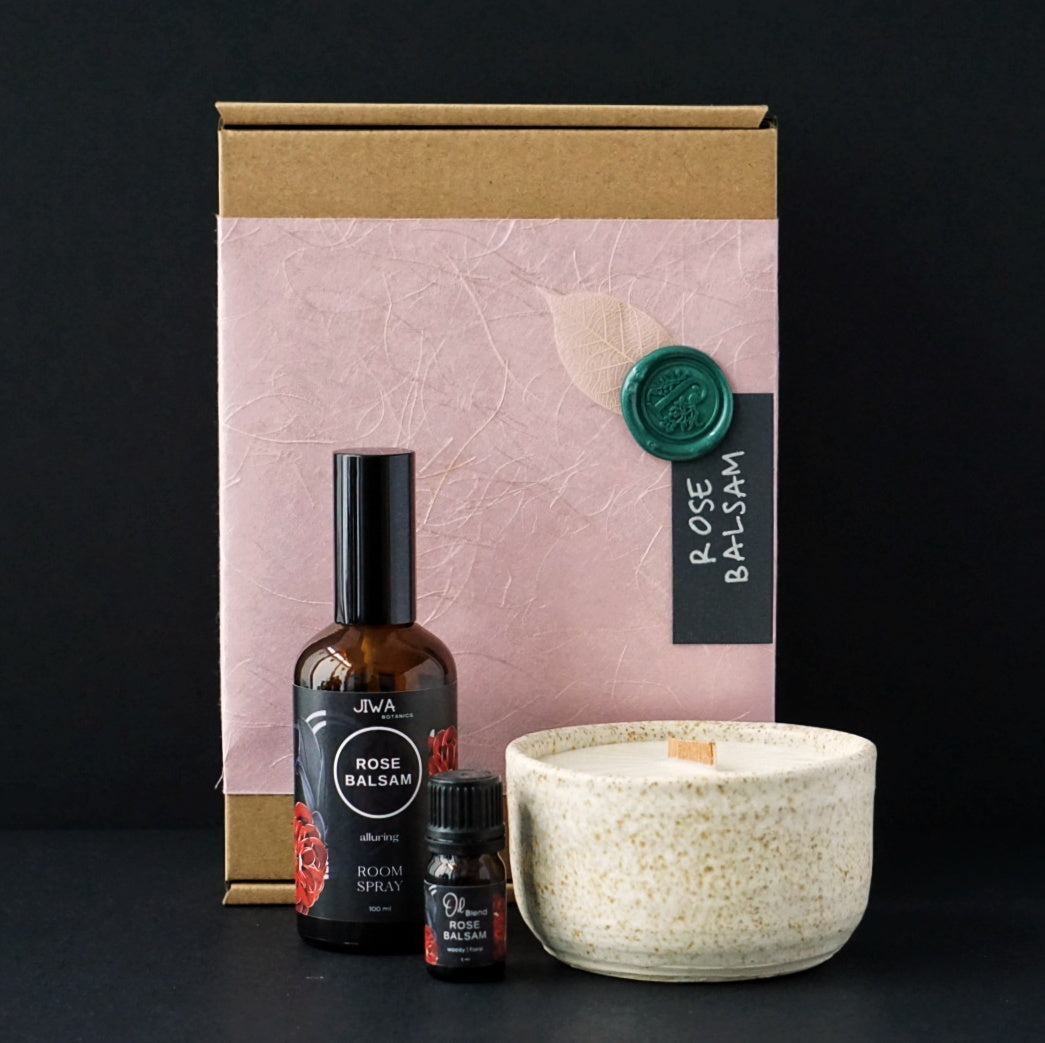 Moroccan Rose absolute with Peru balsam, ginger and cardamom essential oil blend. Aromatherapy gift pack with room spray, oil blend, aromatherapy ceramic candle. Sustainable packaging.