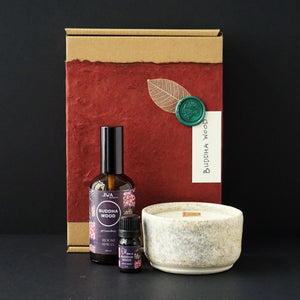 Buddha Wood, Frankincense, Sweet orange, french clary sage, geranium, patchouli essential oil blend. Aromatherapy gift pack with room spray, oil blend, aromatherapy ceramic candle. Sustainable packaging.