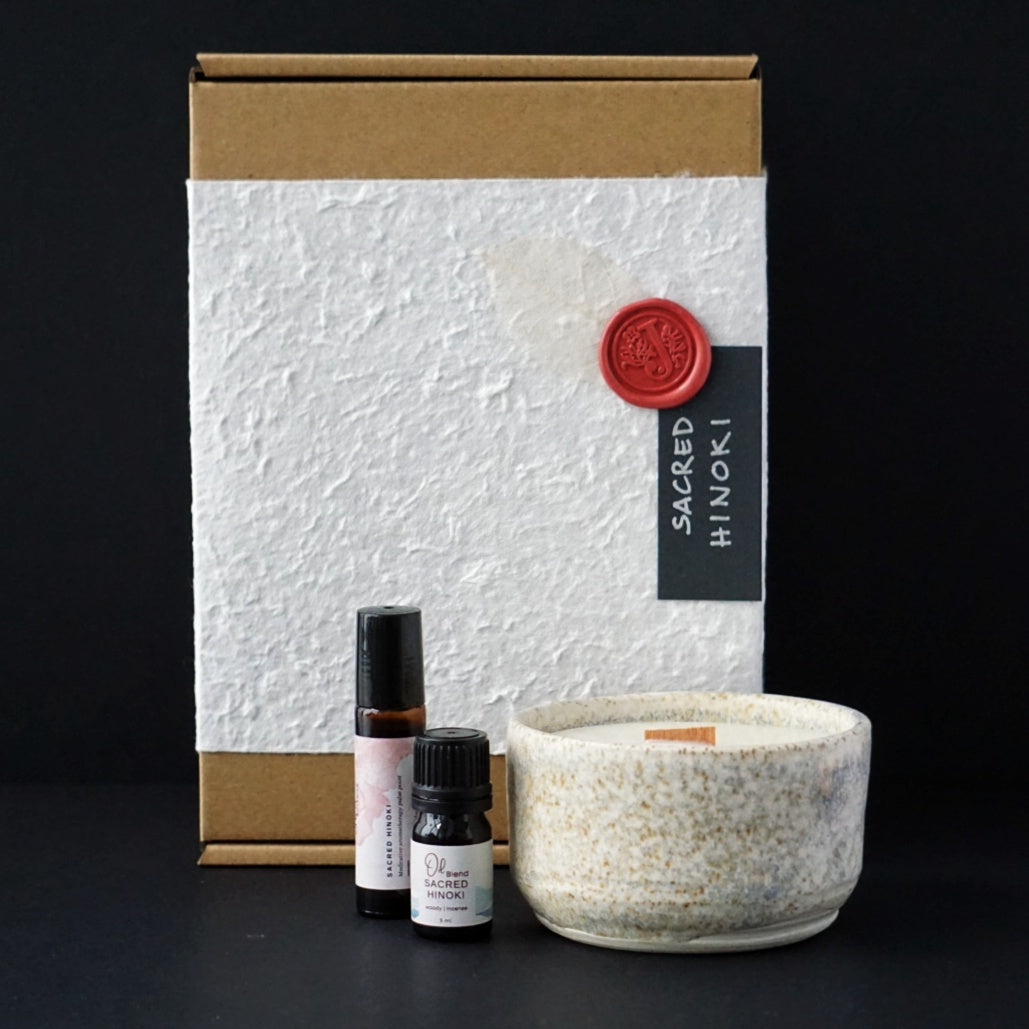 Japanese Hinoki wood, white frankincense, pink grapefruit and a touch of nutmeg, essential oil blend. Aromatherapy gift pack with perfume oil, oil blend, aromatherapy ceramic candle. Sustainable packaging.